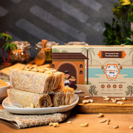 Jaggery Cashew Papersweet rolls topped with cashews on a plate, with the Mittai Shop Atreyapuram Pootharekulu box in the background