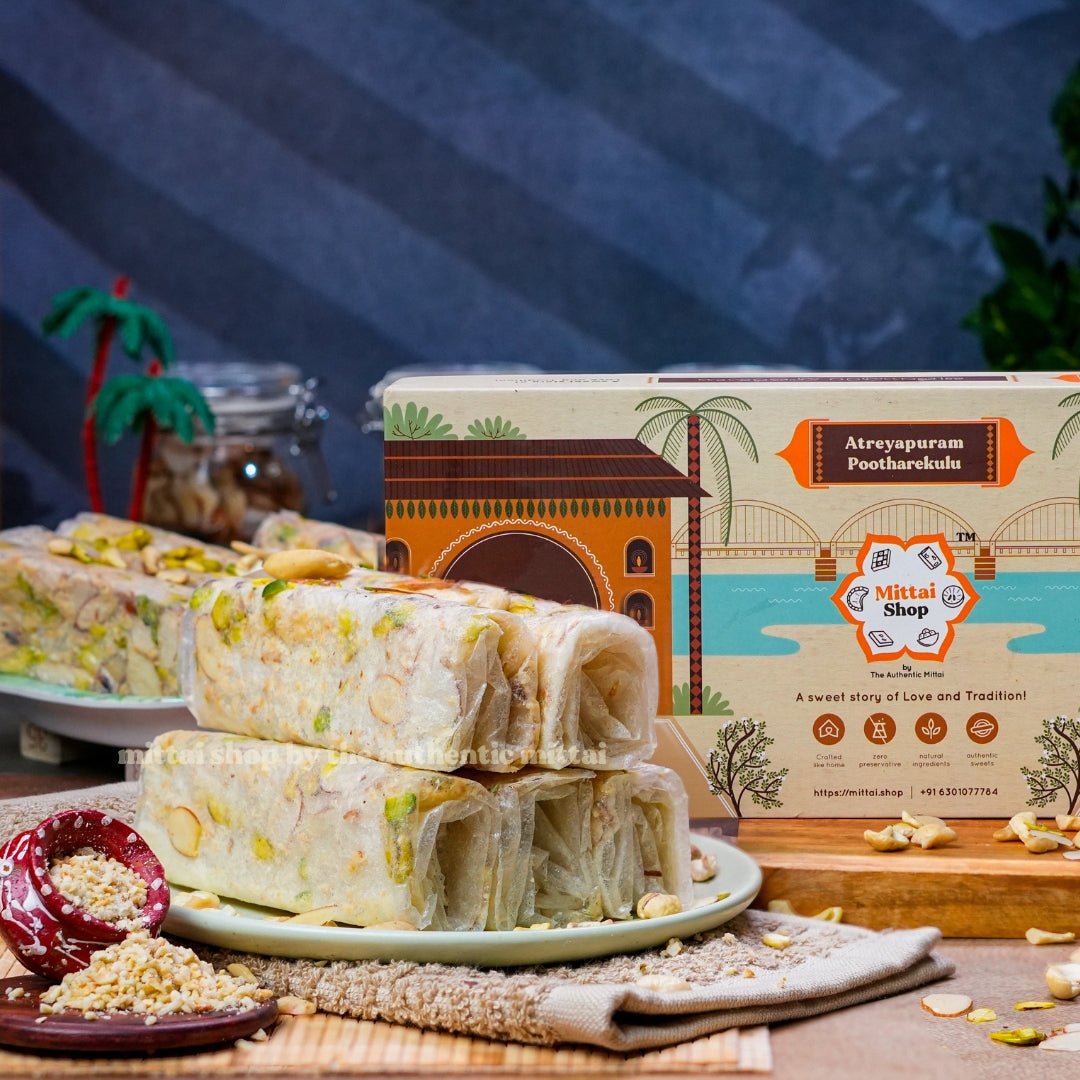 Sugar Dry Fruit Kaju Badam Pista Pootharekulu rolls topped with pistachios and almonds, served on a plate with the Mittai Shop Atreyapuram Pootharekulu box