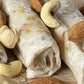 Close-up of Sugar Free Dry Fruit Cashew Almond Pistachio Papersweet rolls topped with almonds and cashews