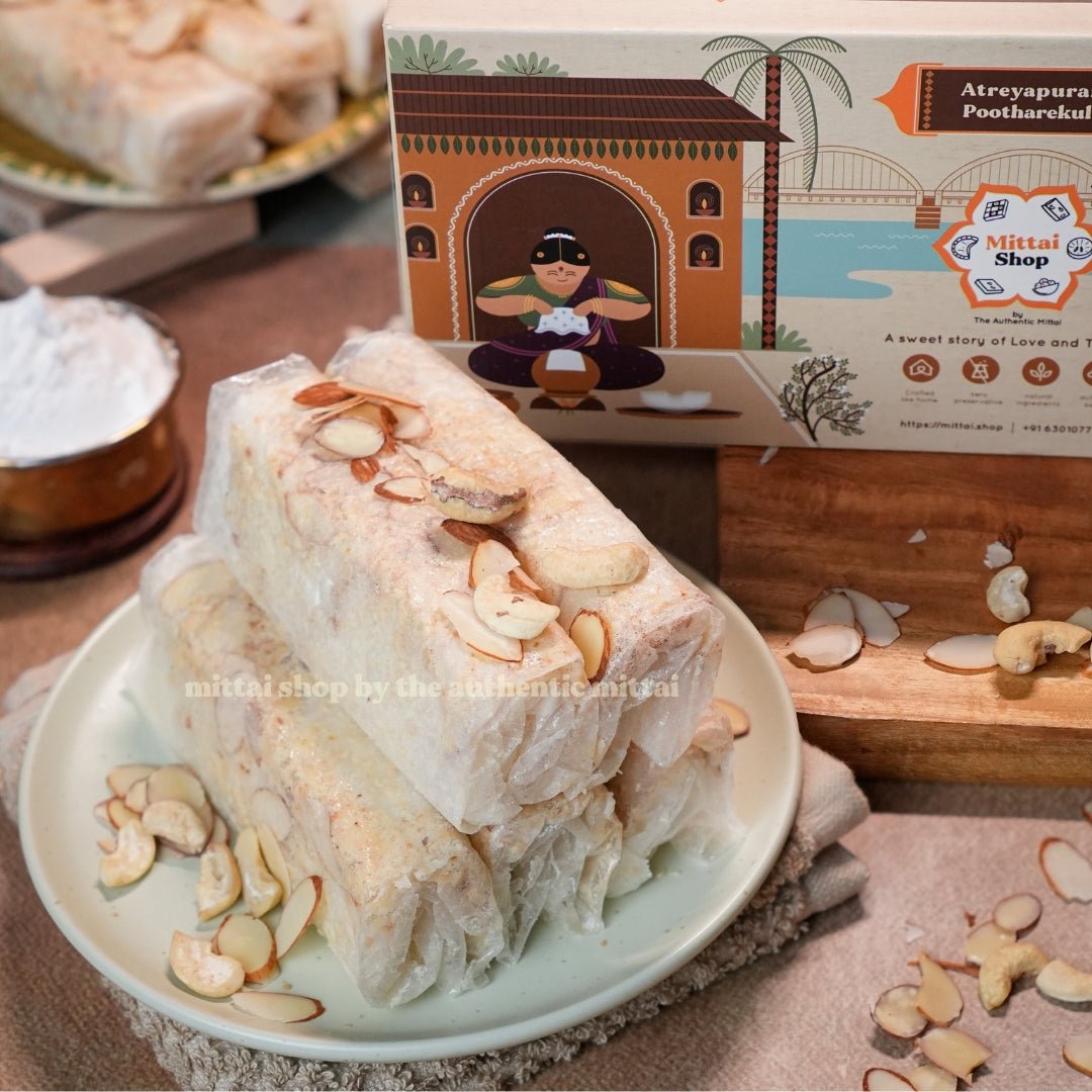 Sugar Kaju Badam Pootharekulu rolls topped with almonds and cashews on a plate, with the Mittai Shop Atreyapuram Pootharekulu box in the background